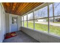 Inviting screened porch with wood ceiling and ample natural light at 8644 S Kinman Dr, , IN 46164