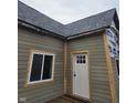 Close up exterior shot featuring new siding, trim, and a new roof at 1016 Dawson St, Indianapolis, IN 46203