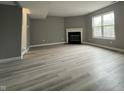 Spacious living room features a fireplace and large window for natural light at 11152 Dura Dr, Indianapolis, IN 46229