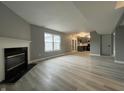 Comfortable living room view with a fireplace and French doors to the kitchen at 11152 Dura Dr, Indianapolis, IN 46229