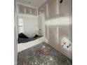 Unfinished bathroom features a new tub and shower combo, awaiting your personal touch at 14910 Garden Mist Pl, Fishers, IN 46037