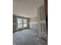 Unfinished bedroom shows bright, natural light streaming through double windows, ready for customization at 14910 Garden Mist Pl, Fishers, IN 46037
