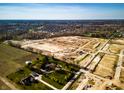 New construction site showcasing the development of a community with future homes and roadways at 14910 Garden Mist Pl, Fishers, IN 46037