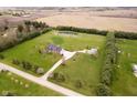 Expansive property featuring a home, outbuilding, pond, and surrounding farmland at 180 S 400 W, Lebanon, IN 46052