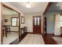 Inviting foyer with hardwood floors, dark wood trim, and natural light streaming through windows at 180 S 400 W, Lebanon, IN 46052