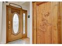 Inviting foyer featuring custom wood doors with decorative glass and carved details at 1907 N Washington St, Danville, IN 46122