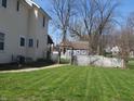 Spacious backyard with well-maintained lawn and pergola at 210 E Monroe St, Alexandria, IN 46001
