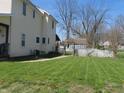 Spacious backyard with well-maintained lawn and pergola at 210 E Monroe St, Alexandria, IN 46001