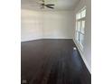 Bright and airy living room featuring dark hardwood floors and a large window at 2250 N Capitol Ave, Indianapolis, IN 46208