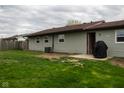 A spacious backyard featuring green grass and view of the home's siding at 248 Parkview Dr, Whiteland, IN 46184