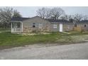 View of the back of home with rear porch at 3302 S Rybolt Ave, Indianapolis, IN 46221