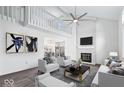 Bright living room with high ceilings, fireplace, modern furniture, and an open view to the dining area at 456 E Arch St, Indianapolis, IN 46202