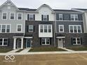 Charming townhome exterior with stone accents, offering a welcoming curb appeal at 5964 Lomita Ave, Plainfield, IN 46168