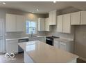 Modern kitchen featuring white cabinets, quartz countertops, and stainless steel appliances at 5964 Lomita Ave, Plainfield, IN 46168