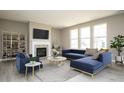 Bright and airy living room with large windows, a fireplace, and modern furnishings at 6718 E Thresher Pass, McCordsville, IN 46055