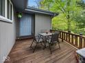 Relaxing outdoor deck with seating, perfect for enjoying the surrounding nature and fresh air at 6827 S 500 W, Trafalgar, IN 46181