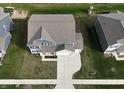 Birds eye view of the home showing its roof and yard with the neighboring homes nearby at 9207 Foudray N Cir, Avon, IN 46123