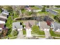 Aerial view of the property, showcasing the roof, yard, nearby pond, and surrounding neighborhood at 9526 Colony Pointe E Dr, Indianapolis, IN 46250