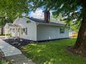 Attractive house features an inviting entrance, clean landscaping, and mature shade trees at 103 N Nebraska St, North Salem, IN 46165