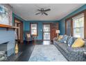 Inviting living room with a decorative fireplace, stylish sofa, and ample natural light at 1116 N Linwood Ave, Indianapolis, IN 46201