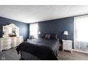 Cozy main bedroom with soft lighting, a comfortable bed, and stylish decor at 1123 Barley Cir, Carmel, IN 46032
