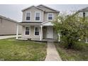 Inviting two-story home with a cozy front porch and well-manicured lawn at 12657 Republic Dr, Fishers, IN 46037