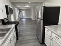 Modern kitchen offering stainless steel appliances, white cabinets, and ample counter space at 1517 N Gladstone Ave, Indianapolis, IN 46201