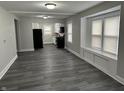 Open-concept living area showcasing new flooring, modern paint, and an adjoining kitchen at 1517 N Gladstone Ave, Indianapolis, IN 46201