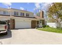 Inviting brick townhouse with attached garage, landscaped front yard, and charming details at 1520 Norfolk Dr, Zionsville, IN 46077