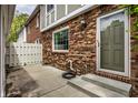 Brick patio with a privacy fence creating a cozy outdoor space with a back door entryway at 156 Aspen Way, Carmel, IN 46032
