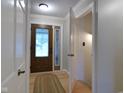 Bright foyer featuring a patterned front door and classic white trim at 1737 Friendship Dr, Indianapolis, IN 46217