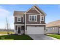 Charming two-story home featuring a two-car garage, neat landscaping, and a classic design at 2268 Marjorie Way, Shelbyville, IN 46176