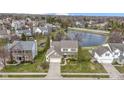 Lovely home and landscaping, pond view, and beautiful neighborhood make this house desirable at 300 Wyndotte Dr, Carmel, IN 46032