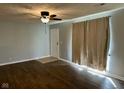 Living room with hardwood floors, neutral walls, and a ceiling fan at 3841 Monica Ct, Indianapolis, IN 46226