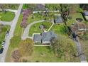 An aerial view showcasing a home with mature trees and greenery offering a private setting at 4337 Lincoln Rd, Indianapolis, IN 46228