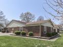 Lovely home featuring manicured landscaping, a brick exterior and attached garages at 4412 Mountbatten Ct, Indianapolis, IN 46254