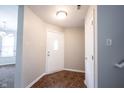 Clean entryway featuring neutral walls, stylish tile flooring, and a convenient closet space at 4545 Connaught East Dr, Plainfield, IN 46168