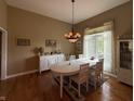 Elegant dining room featuring a chandelier, large windows, and a white dining set at 6087 Boulder Ct, Columbus, IN 47201