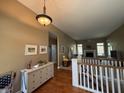 Bright entryway leading to a spacious living room with hardwood floors and a fireplace at 6087 Boulder Ct, Columbus, IN 47201