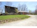 Beautiful combination brick and cedar home with spacious front lawn at 701 E Main St, Westfield, IN 46074