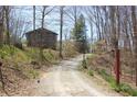 Secluded wooded lot featuring charming home and separate smaller dwelling at 701 E Main St, Westfield, IN 46074