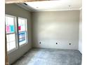 A versatile room with neutral paint, recessed lighting, and a large window for ample natural light at 792 Oakleaf Dr, Greenfield, IN 46140
