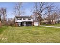 Traditional two-story home boasting a spacious front yard and an attached two-car garage at 8180 E County Road 400 N, Brownsburg, IN 46112