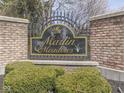 Marlin Meadows community entrance sign set amongst decorative bushes and brick pillars at 8926 New Heritage Ct, Indianapolis, IN 46239