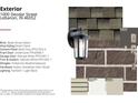 Close up of the exterior finishes including the brick, siding, and roof shingles at 1000 Deodar St, Lebanon, IN 46052