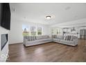 Spacious living room with fireplace, hardwood floors, and plenty of natural light at 10524 Broadford St, Indianapolis, IN 46239