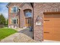 Charming brick home featuring a well-manicured lawn and close-up view of house number at 1121 Retford Ct, Greenwood, IN 46143