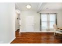 Welcoming entryway with hardwood floors, neutral paint, and a view into the main living space at 1315 Hazy Falls Blvd, Westfield, IN 46074
