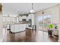 Modern kitchen with white cabinets, stainless steel appliances, and an island at 1334 Winfield Way, Greenwood, IN 46143