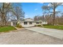 Wide concrete driveway leading to a well maintained single Gathering home at 1502 N Matthews Rd, Greenwood, IN 46143